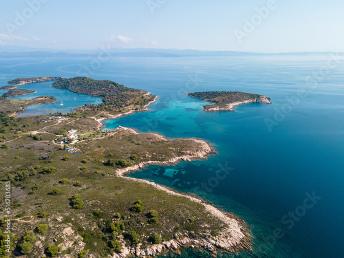 Aerial view of Diaporos Island in Halkidiki, Greece, Small islands with blue lagoon in the Aegean sea during summer holiday season
