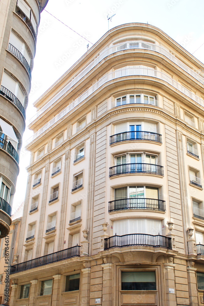 Nice facade of old design building in the main avenue of the city