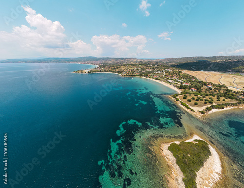 Aerial panorama of turquoise sea waters in Sithonia, Halkidiki . Summer holiday season in Kastri, Greece