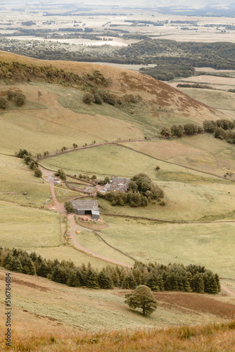 Fields with farm buildings in the rolling hills