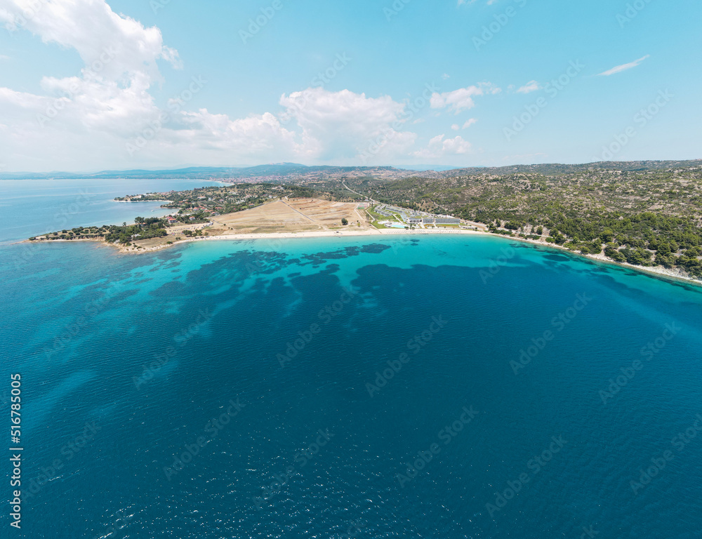 Aerial view of Agios Ioannis beach in Sithonia peninsula of Chalkidiki, Greece,  Tropical turquoise water during summer holiday season