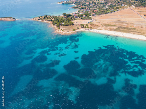 Aerial view of turquoise sea waters in Sithonia, Halkidiki . Summer holiday season in Kastri, Greece
