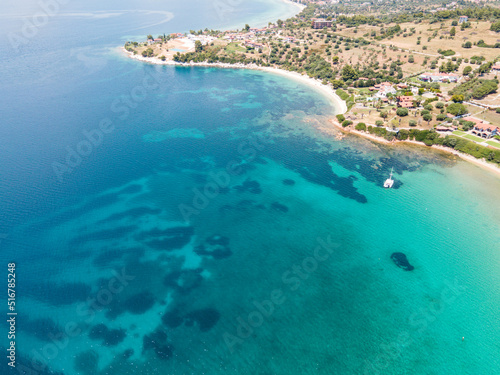 Aerial view of turquoise sea waters in Sithonia, Halkidiki . Summer holiday season in Kastri, Greece