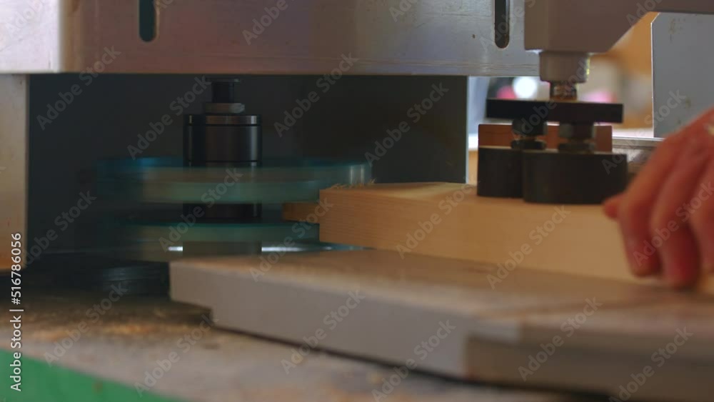 Carpenter in the workshop, works with wood, makes furniture parts in natural light. Carpentry tools Carpenter in the workshop, works with wood, makes furniture parts in natural light. Carpentry tools