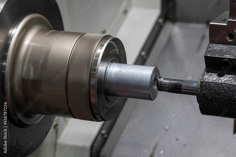 Closeup scene the lathe machine bore cutting the metal parts by lathe tools. Closeup scene the lathe machine bore cutting the metal parts by lathe tools.