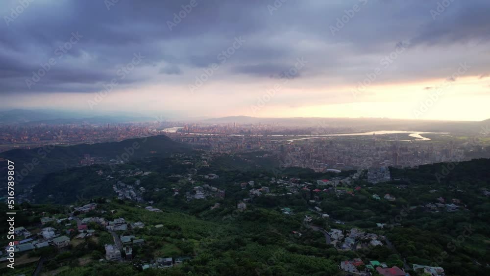 Overlooking Taipei, Taiwan from a mountain during dramatic cloudy sunset - Drone Forward push Overlooking Taipei, Taiwan from a mountain during dramatic cloudy sunset - Drone Forward push
