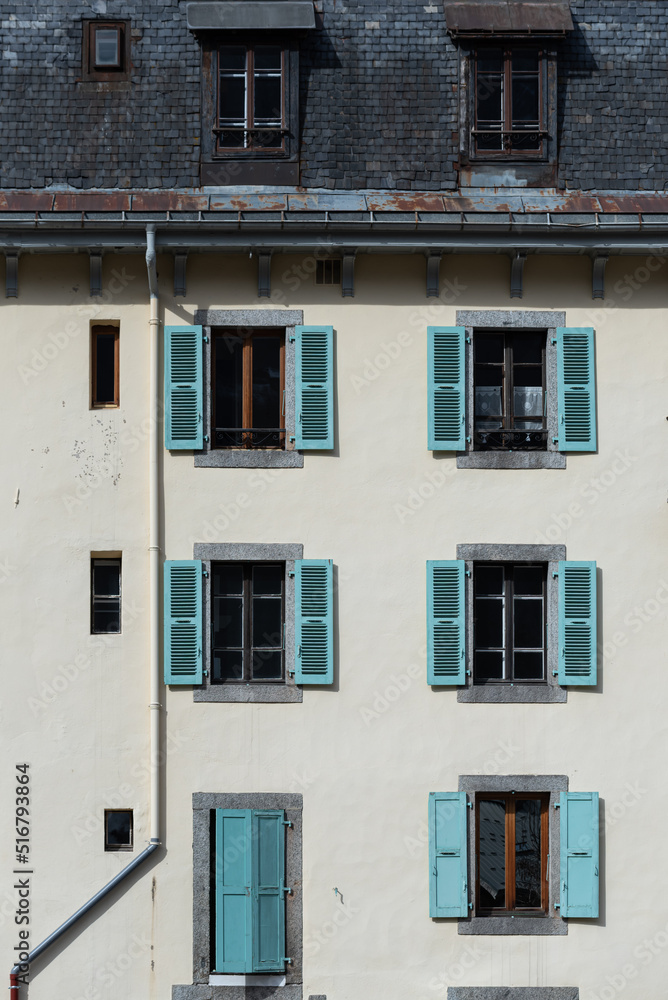 Classic Chamonix apartment building facade with shuttered windows