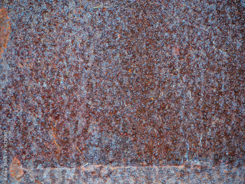 Rusty grunge background. Gray-red rusty metal background. Old metal rusty texture close-up © Alekskan12