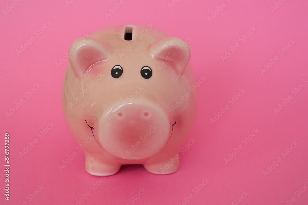 Piggy Bank on the pink background. Money saving concept.