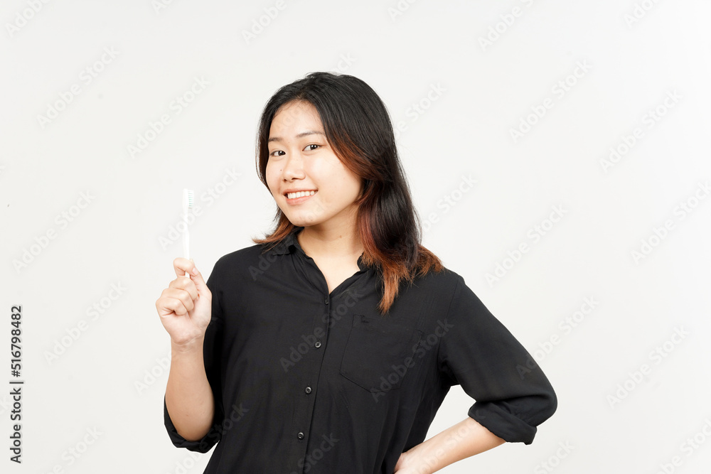 Holding toothbrush and smiling to camera of Beautiful Asian Woman Isolated On White Background Holding toothbrush and smiling to camera of Beautiful Asian Woman Isolated On White Background