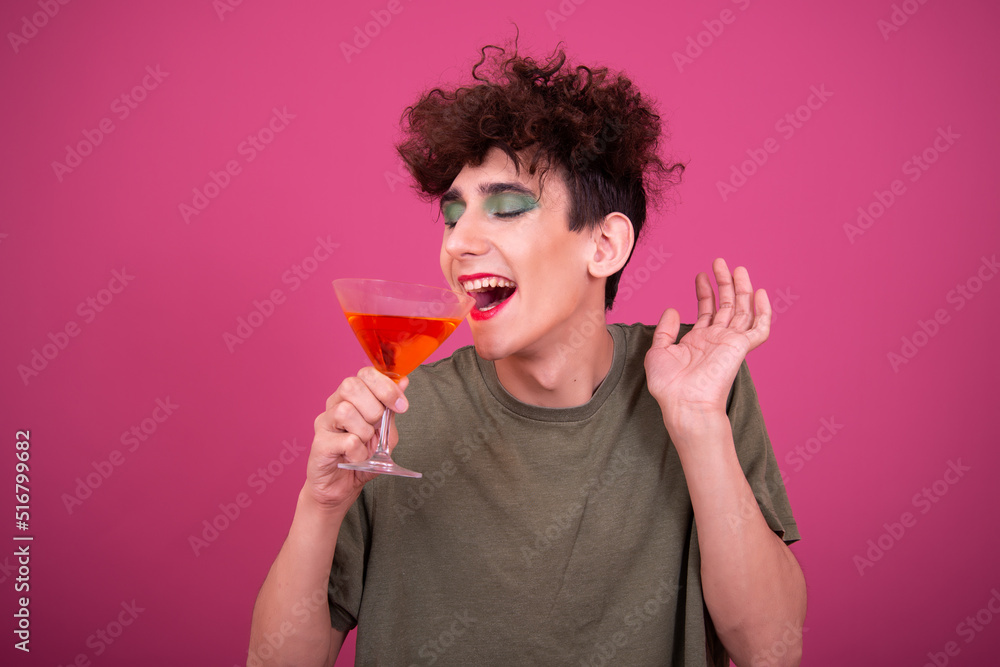Drag queen drinks a cocktail. Funny guy in make-up. Drag queen drinks a cocktail. Funny guy in make-up.