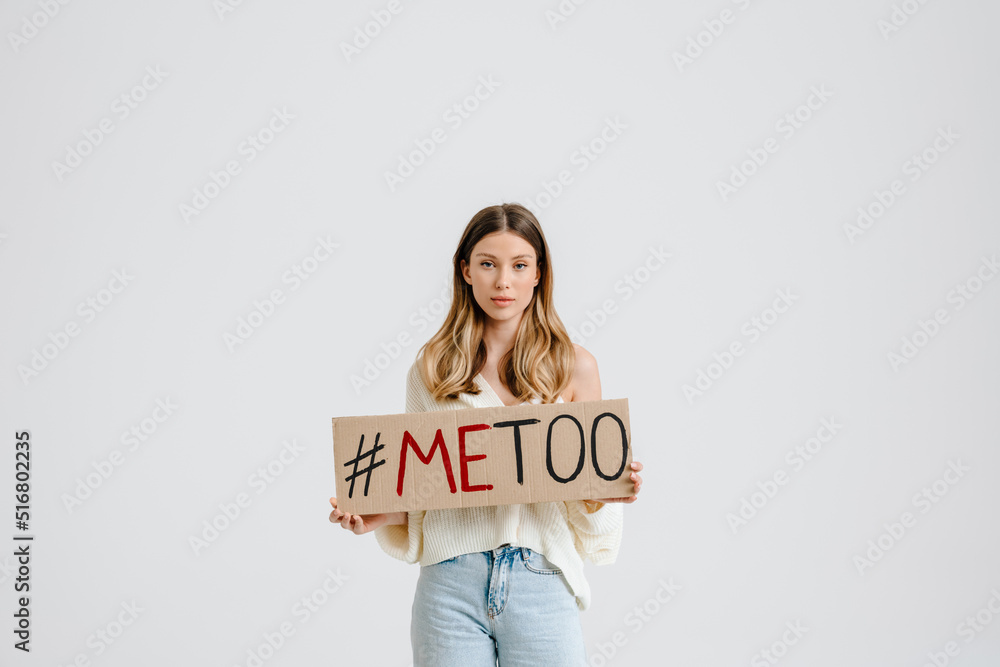 Young brunette woman holding placard with me too text Young brunette woman holding placard with me too text