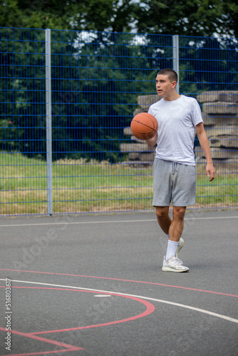 A Nineteen Year Old Teenage Boy Playing Basketball
