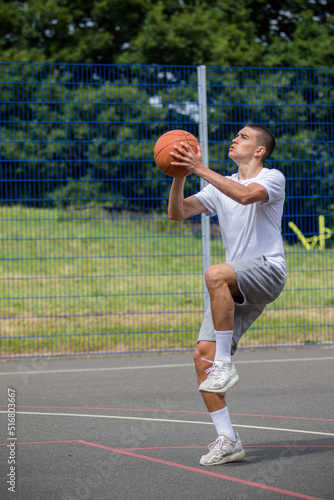 A Nineteen Year Old Teenage Boy Playing Basketball