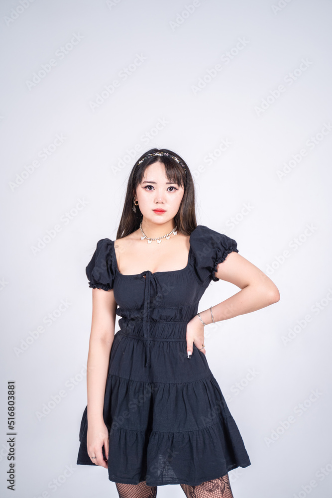 lovely young woman with painted eyes looks at the camera lovely young woman with painted eyes looks at the camera