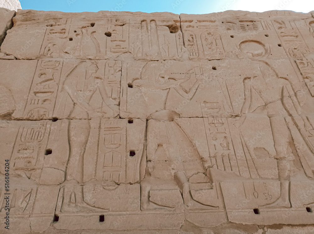 Detail of the hieroglyphs carved on the stone of an ancient wall in Egypt