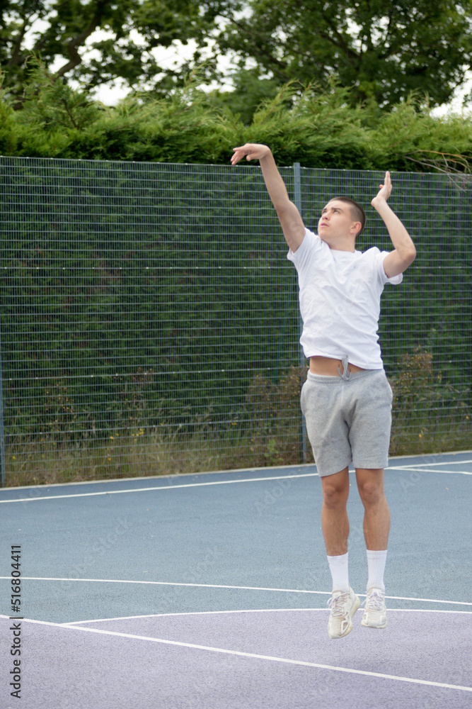 A Nineteen Year Old Teenage Boy Playing Basketball A Nineteen Year Old Teenage Boy Playing Basketball