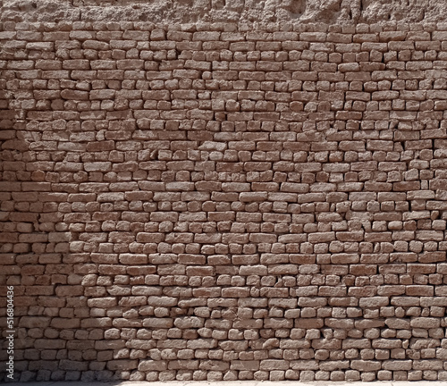 Texture of an old wall made with stone bricks of sandstone in Egypt