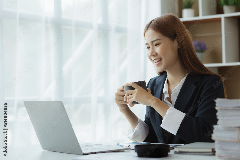 Business woman working in a private office, she is reviewing the company's financial documents sent from the finance department before he takes it to a meeting with a business partner. Financial conce Business woman working in a private office, she is reviewing the company's financial documents sent from the finance department before he takes it to a meeting with a business partner. Financial conce