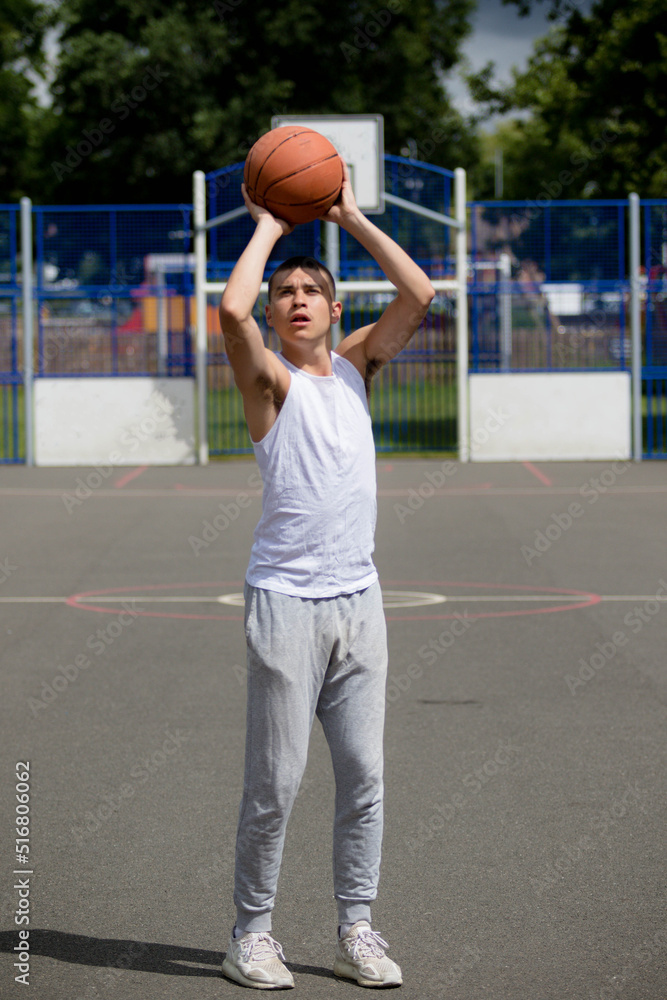 A Nineteen Year Old Teenage Boy Playing Basketball A Nineteen Year Old Teenage Boy Playing Basketball