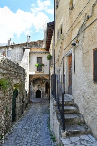 A narrow street between the old stone houses of Campo di Giove, a medieval village in the Abruzzo region of Italy.