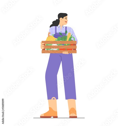 Fall harvest. Flat vector illustration with farmer in uniform and boots holding a box of harvested crops. Concept of harvesting people.