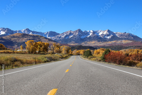 Highway to the Rockies. Epic autumn view of color-changing aspens and the snow-dusted Rocky Mountains of South-Western Colorado.