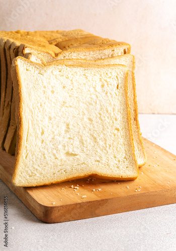 Stack of slice bread isolated on bright background with negative space