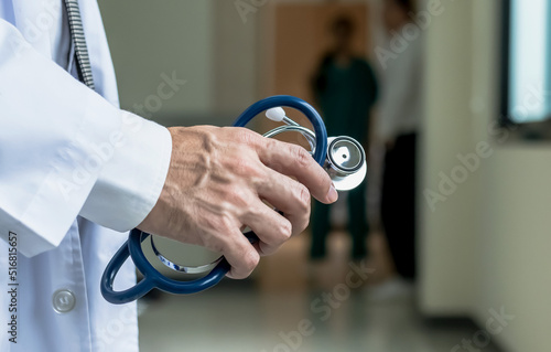 Close up doctor hand holding stethoscope in hospital, Hospital business