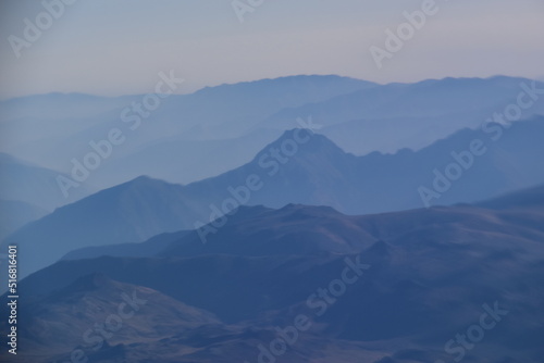 The Hazy Peruvian Andes Mountains seen from an airplane