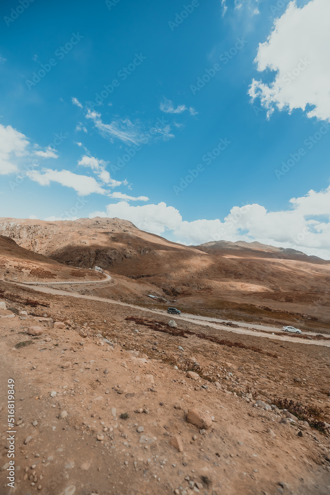 landscape of a desolate dry mountain terrain in Deosai National Park in north Pakistan on sunny day