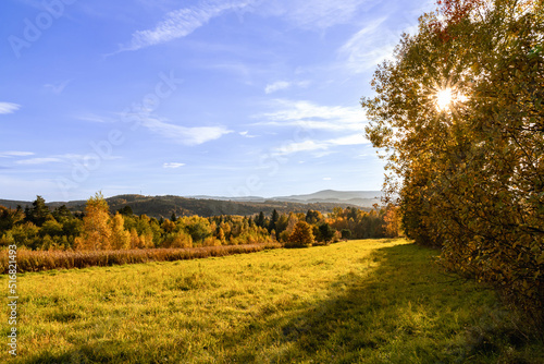Autumn landscape with shining sun