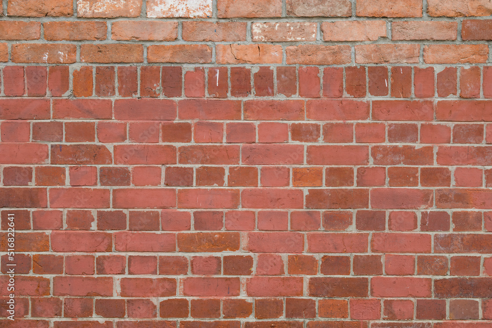 Fototapeta premium Red brick wall building exterior