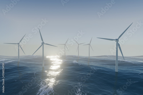 Farm of wind turbine power generators standing in the ocean during sunset.