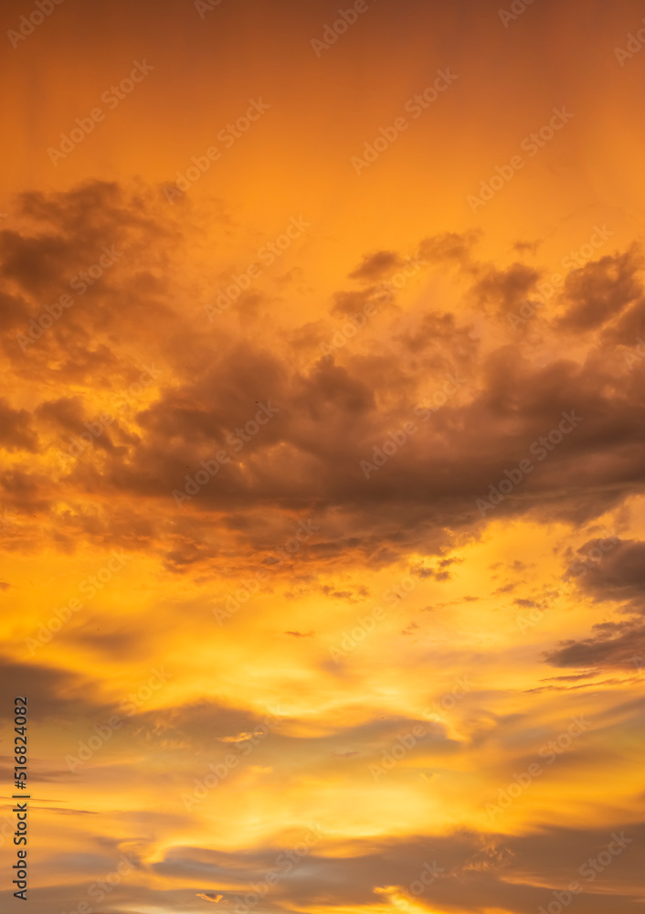 fiery orange and purple sky evening beauty and Clouds at sunset , dawn, the rays of the sun break through the clouds.