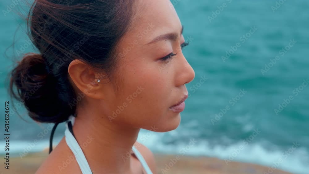 Portrait of beautiful asian female is sad on the seaside Portrait of beautiful asian female is sad on the seaside