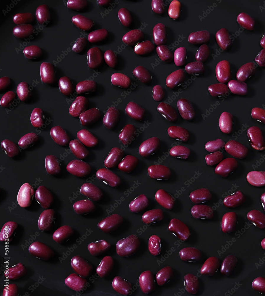 Scattered beans on a dark background. Close-up Scattered beans on a dark background. Close-up
