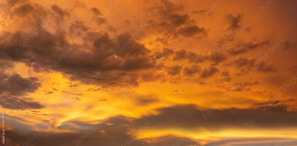 fiery orange and purple sky evening beauty and Clouds at sunset , dawn, the rays of the sun break through the clouds.