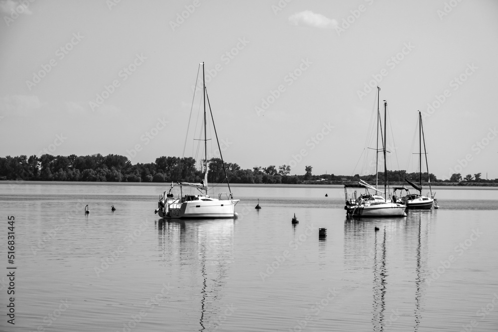 Fototapeta premium Sailboat moored in the harbor for boats, yachts and sailboats in a recreational destination