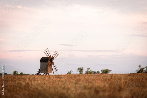 windmill in the field at sunset