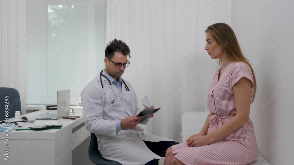 the doctor informs the patient that the treatment did not give the desired result, from which the girl begins to cry, and the doctor tries to comfort her. the doctor informs the patient that the treatment did not give the desired result, from which the girl begins to cry, and the doctor tries to comfort her.