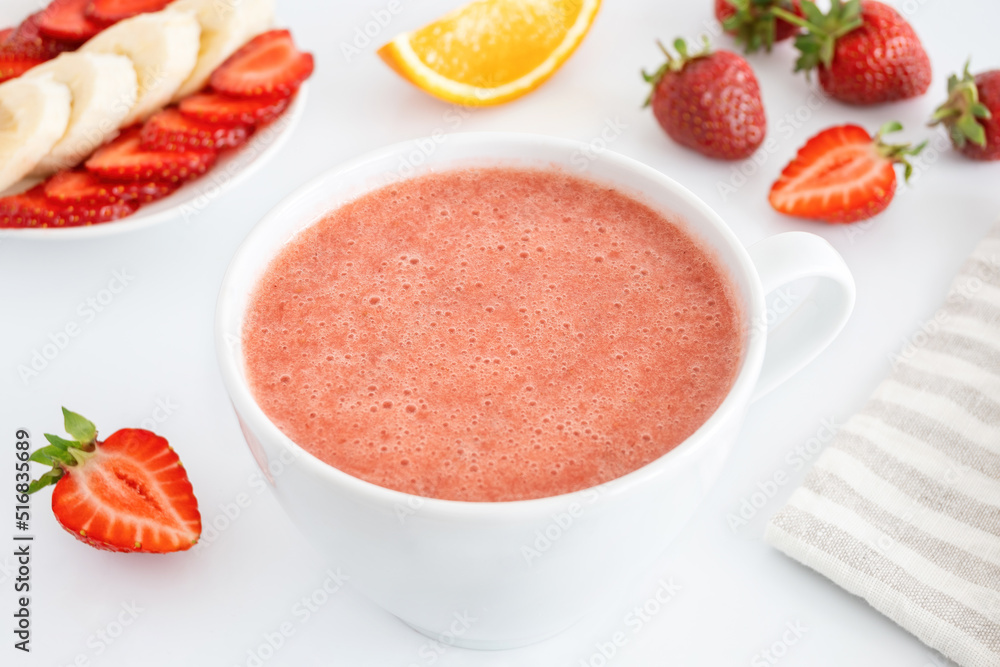 Red smoothie made of strawberry and fruits. Summer detox cocktail with berries and banana. Sweet healthy drink for raw diet. Red smoothie made of strawberry and fruits. Summer detox cocktail with berries and banana. Sweet healthy drink for raw diet.