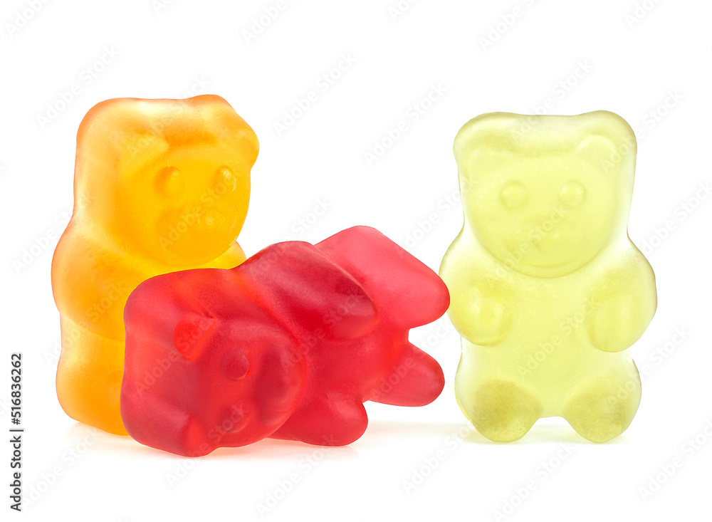 Three colored jelly bears isolated on a white background. Jelly candy. Marmalade bears. Three colored jelly bears isolated on a white background. Jelly candy. Marmalade bears.