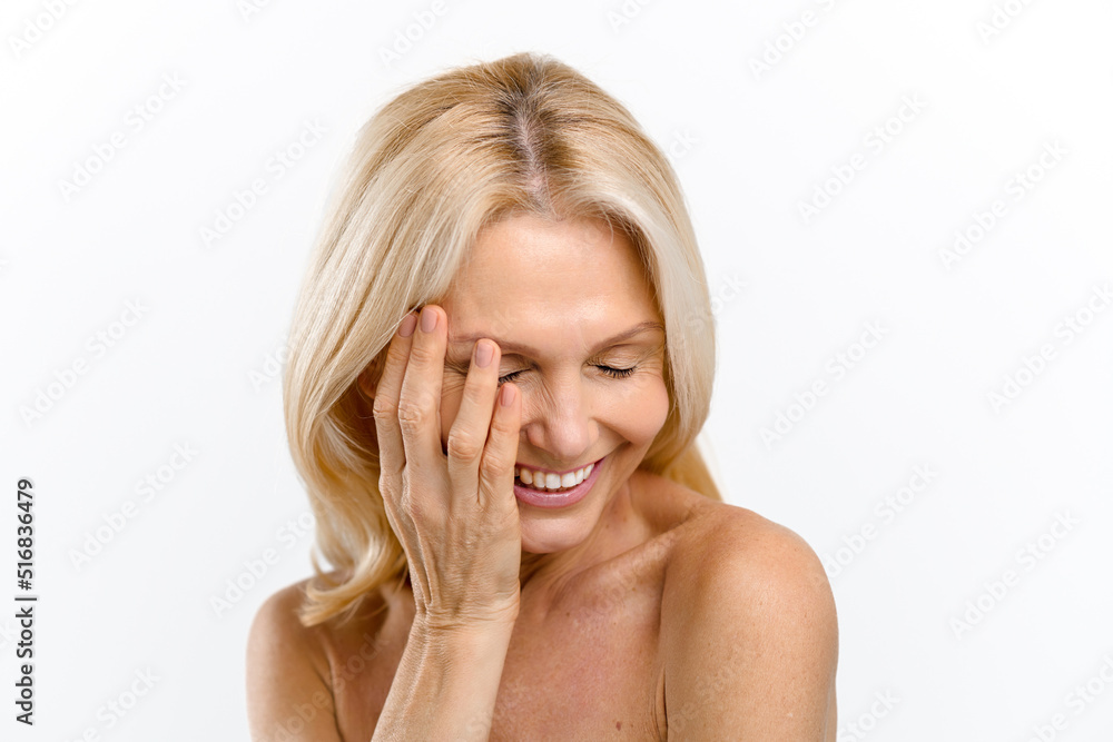 Serene and carefree middle-aged half-naked woman laughing isolated on white. Selfcare concept Serene and carefree middle-aged half-naked woman laughing isolated on white. Selfcare concept