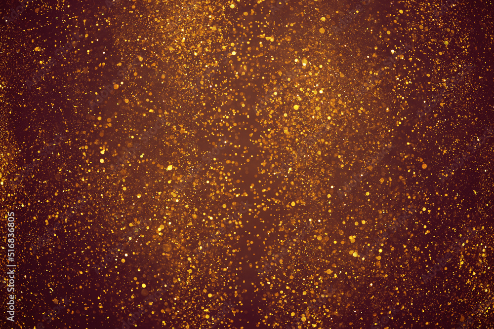 Golden glitter dust festive lights abstract bokeh background