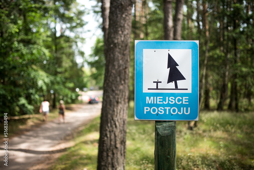 Car park sign in the middle of forest.