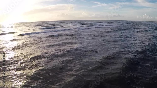Aerial view of the sea and beach at sunset on the water