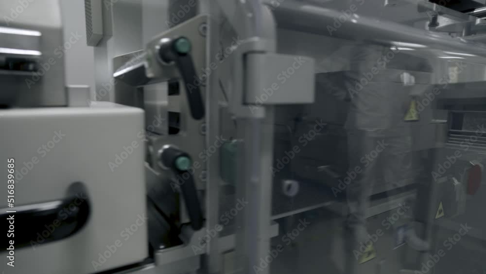 Photo sensor detect medicine bottles on line conveyor in pharmaceutical industry. Industrial Machine for quality of medical product in line conveyor processing. Industrial and technology concept. Photo sensor detect medicine bottles on line conveyor in pharmaceutical industry. Industrial Machine for quality of medical product in line conveyor processing. Industrial and technology concept.
