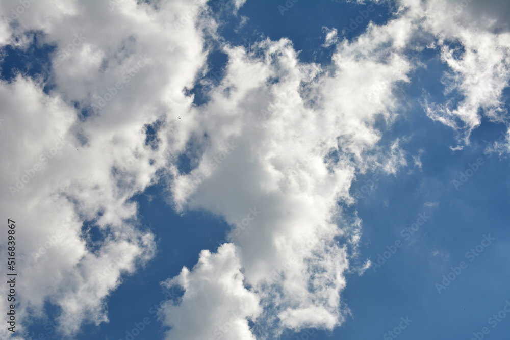Clouds in the blue sky . Clouds in the blue sky .