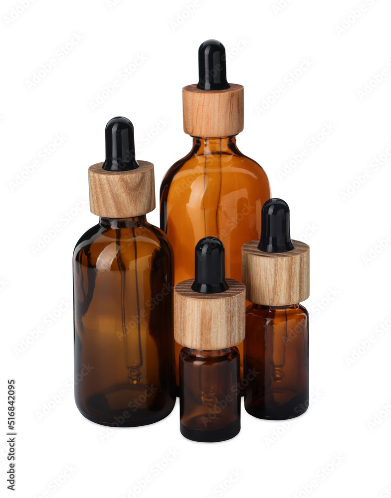 New empty glass bottles with droppers isolated on white New empty glass bottles with droppers isolated on white